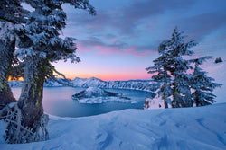 Crater Lake in the snow at sunrise