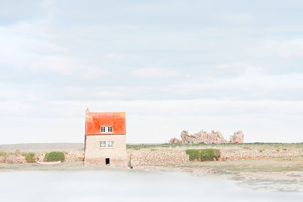 tidal mill in france with red roof. 