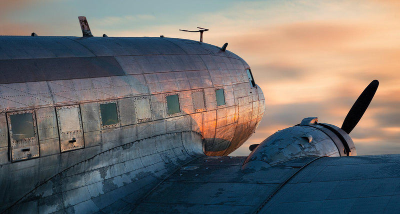 Fine art aviator photography of a DC-3 or C-47 at sunset. 