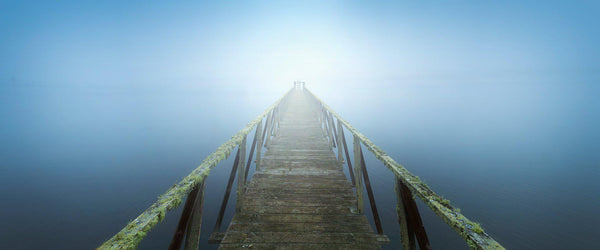 Pier going into fog on the California coast. 