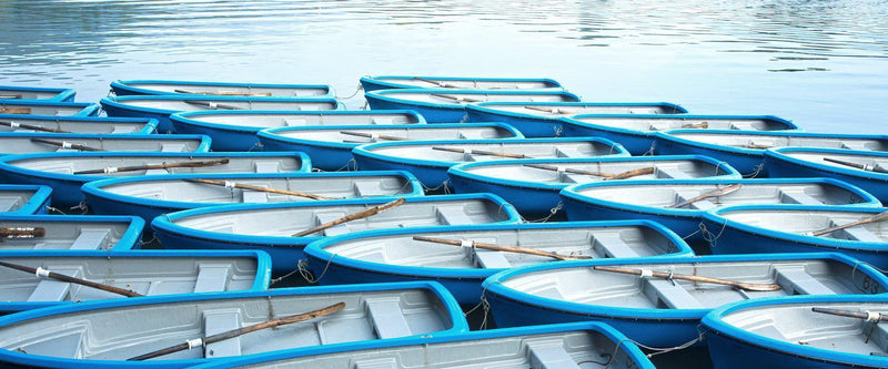Photograph of row boats lined up in Kyoto Japan. 