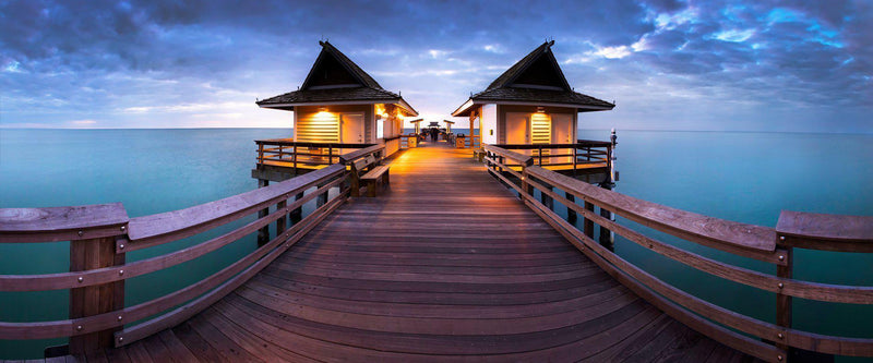 Photograph of the Naples Pier in florida at dusk. 
