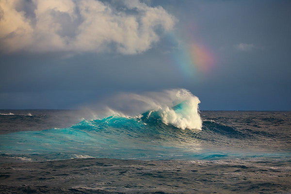 Fine art photographs of large waves and a rainbow at Jaws on Maui Hawaii. 