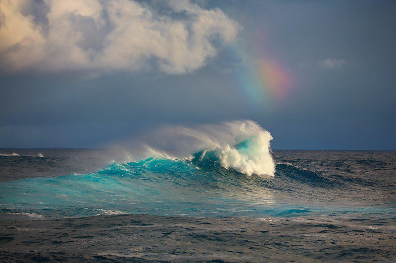 Fine art photographs of large waves and a rainbow at Jaws on Maui Hawaii. 