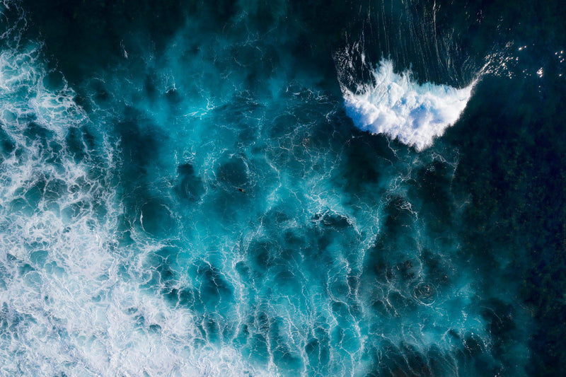 A little wave crashes through the aftermath of a massive wave 
