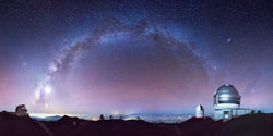 Photography of Observatories on the top of Mauna Kea under the Milky Way on the Big Island of Hawaii. 