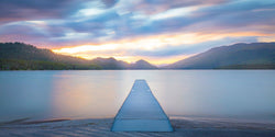 Dock on whitefish lake in montana at sunset. 